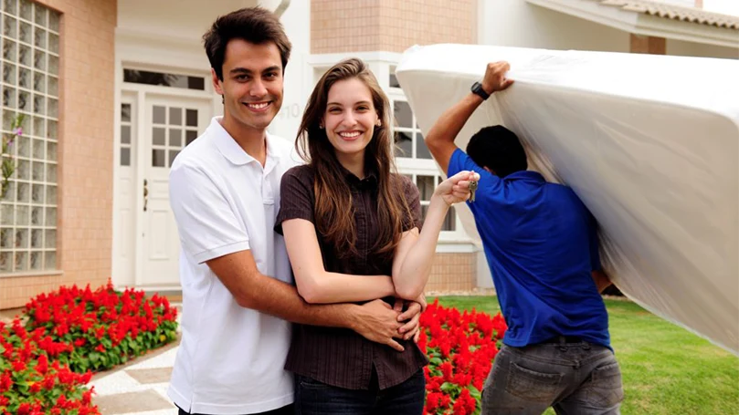 an image of a couple getting a new mattress