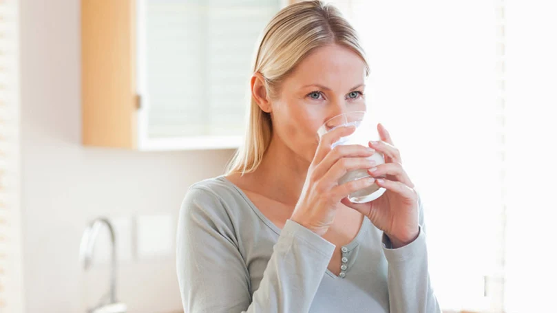 an image of a woman hydrating herself