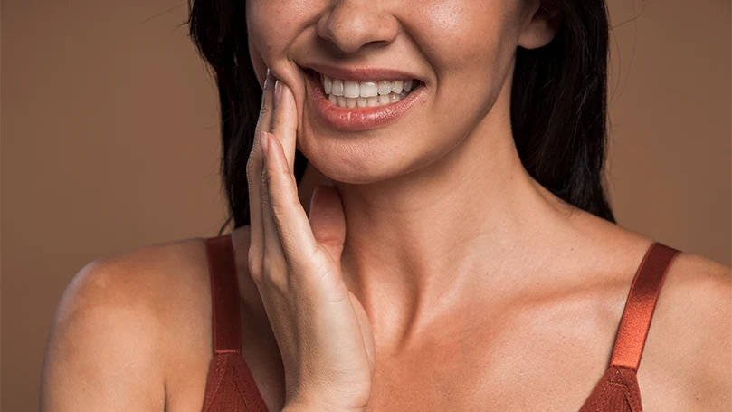 An image of a woman suffering from sore jaw.