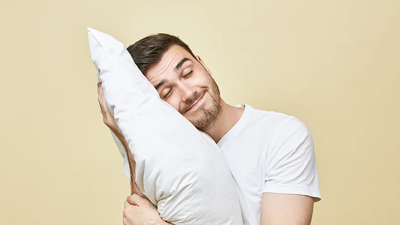 An image of a young man taking a day nap after the workout.