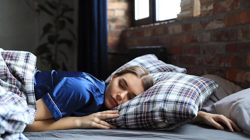 a-young-woman-sleeping-in-a-bed