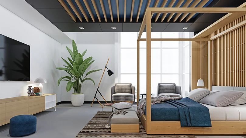 An image of a modern bedroom with a canopy bed.