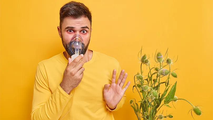 A young man using oxygen therapy to overcome sleep apnea.