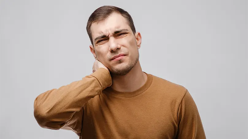 An image of a young man having pain due to nerve problems.