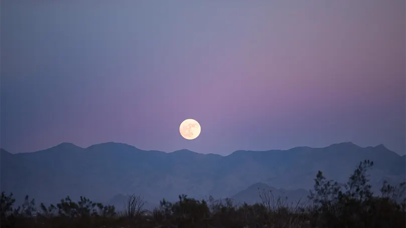 An image of a full moon in the evening.