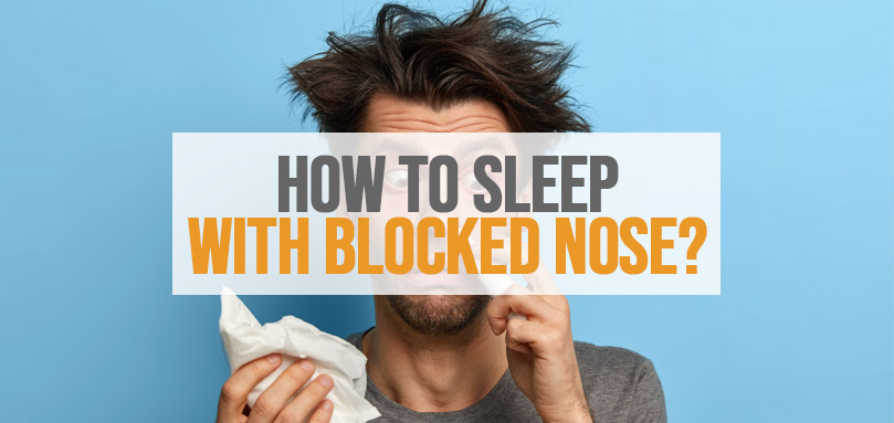 Featured image of how to sleep with blocked nose.