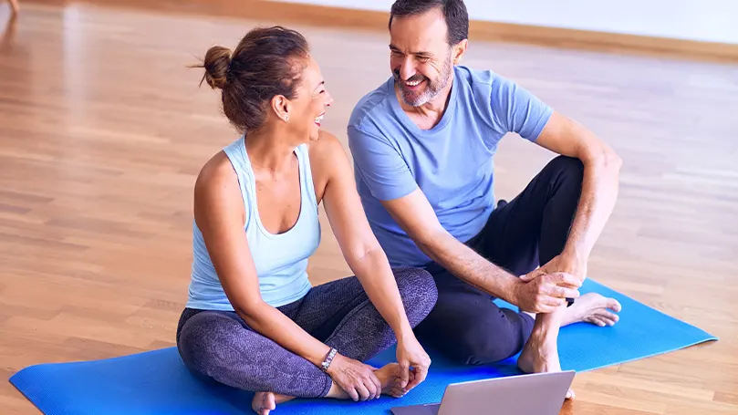 An image of two people resting after having exercised