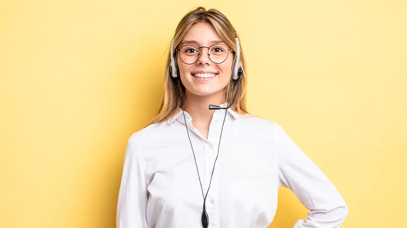 An image of a young woman working as a customer support