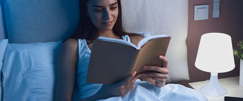 Woman reading in bed