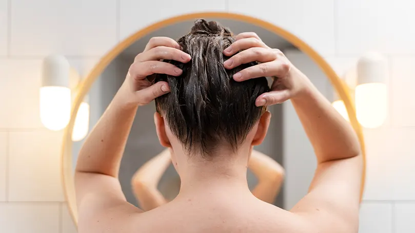 a woman washing her hair