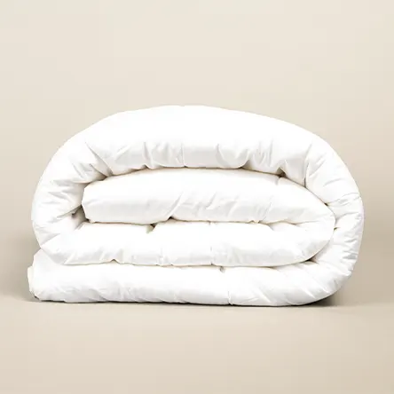 A folded white duvet